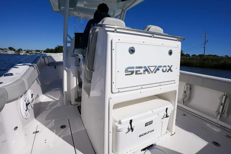  Yacht Photos Pics 2022 Sea Fox 288 Commander boat interior with seating and storage, cruising on a sunny day.