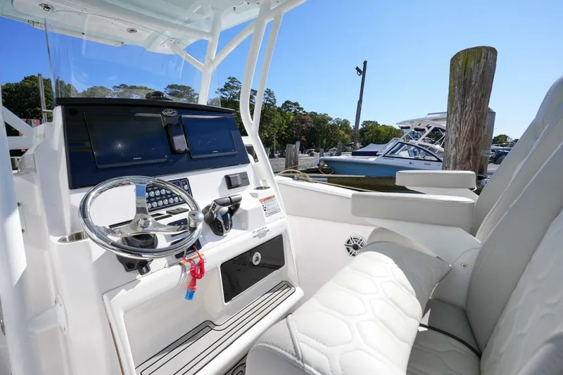  Yacht Photos Pics 2022 Sea Fox 288 Commander boat interior with steering wheel and control panel.