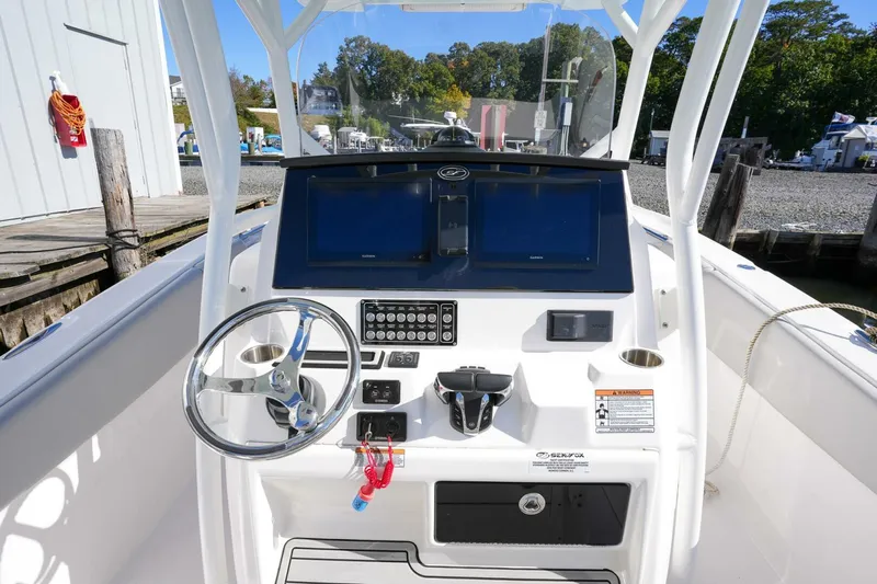  Yacht Photos Pics 2022 Sea Fox 288 Commander boat dashboard with steering wheel and controls.