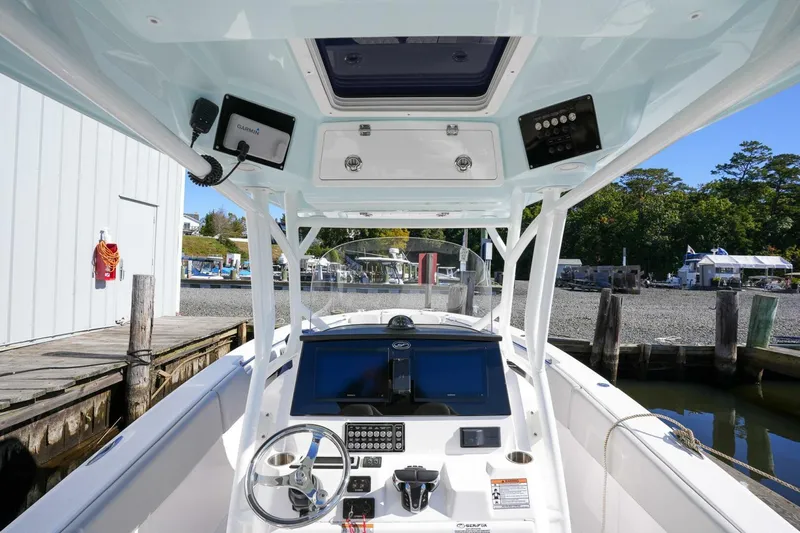  Yacht Photos Pics 2022 Sea Fox 288 Commander boat interior with modern dashboard and controls at a dock.