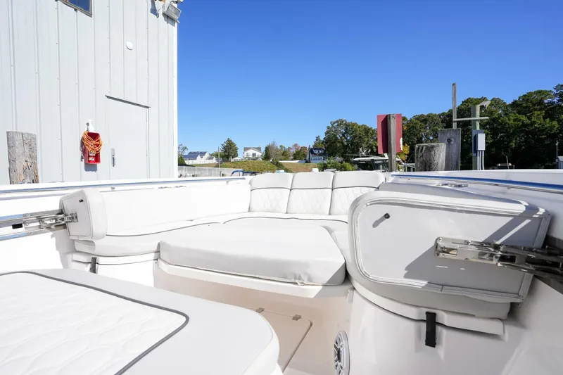  Yacht Photos Pics 2022 Sea Fox 288 Commander boat interior with white seating and storage compartments.