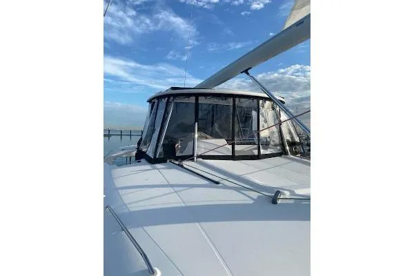 Whatif Yacht Photos Pics 2013 Lagoon 450 catamaran with sails, under a clear blue sky.