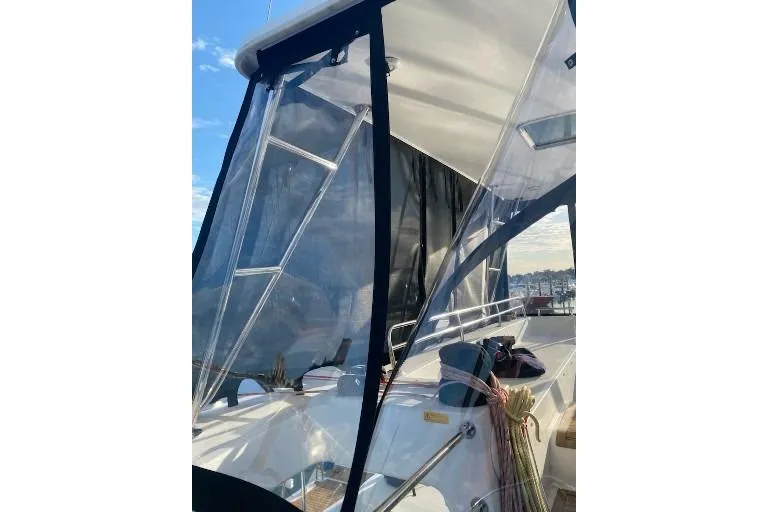 Whatif Yacht Photos Pics Lagoon 450 catamaran, 2013 model, featuring a clear enclosure and deck view.