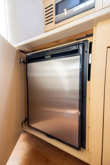 Pura Vida Yacht Photos Pics Stainless steel mini fridge in 2012 Sea Ray 370 Sundancer yacht kitchen.