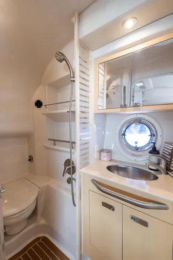 Pura Vida Yacht Photos Pics Luxurious bathroom in 2012 Sea Ray 370 Sundancer yacht with shower and sink.