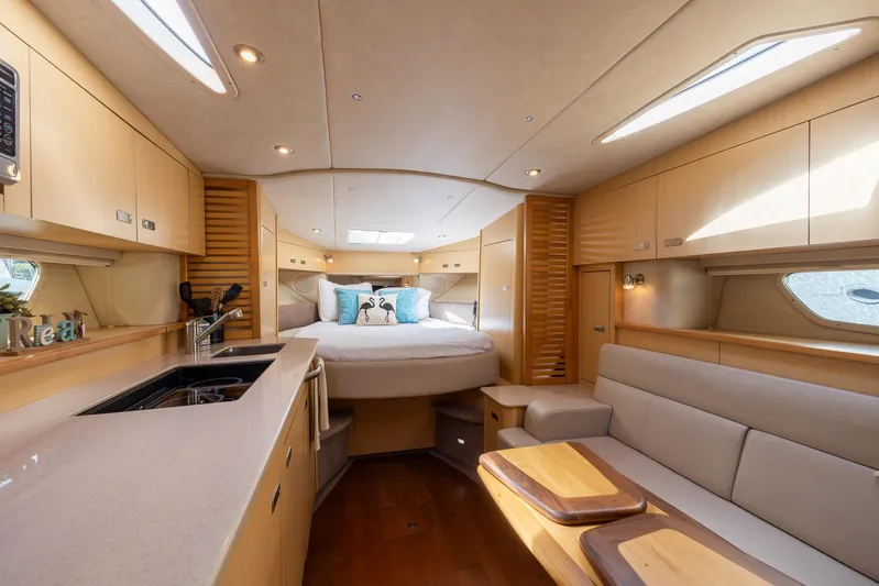 Pura Vida Yacht Photos Pics Luxurious interior of 2012 Sea Ray 370 Sundancer yacht with modern amenities.