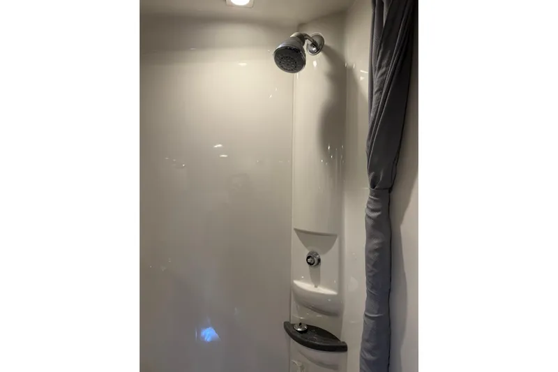  Yacht Photos Pics Shower area in 2018 Formula 400 Super Sport boat, featuring modern fixtures and curtain.