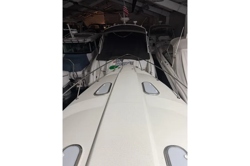  Yacht Photos Pics 2018 Formula 400 Super Sport boat docked in a marina, surrounded by other vessels.