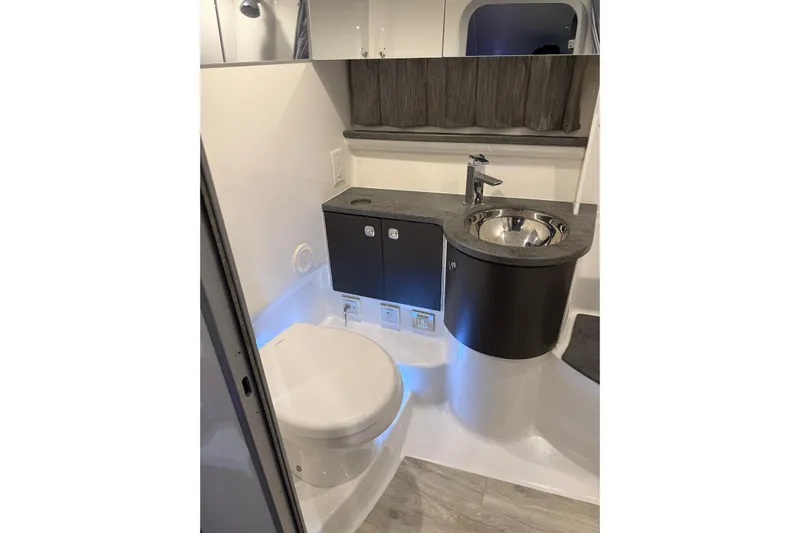  Yacht Photos Pics 2018 Formula 400 Super Sport yacht bathroom with modern sink and toilet.