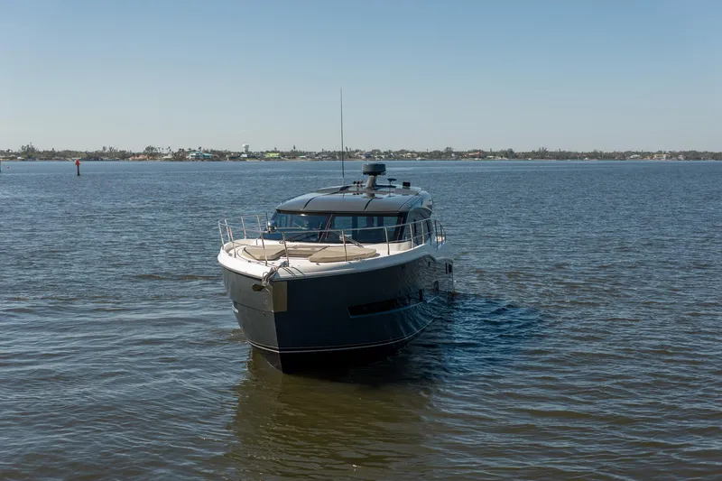 Going Coastal Yacht Photos Pics A 2019 Carver C43 Coupe yacht cruising on a calm, sunny day.