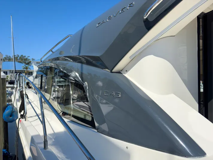 Going Coastal Yacht Photos Pics 2019 Carver C43 Coupe yacht docked, showcasing sleek design and modern features.