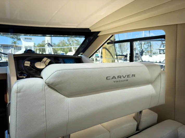 Going Coastal Yacht Photos Pics Interior of a 2019 Carver C43 Coupe yacht, featuring luxurious seating and helm.