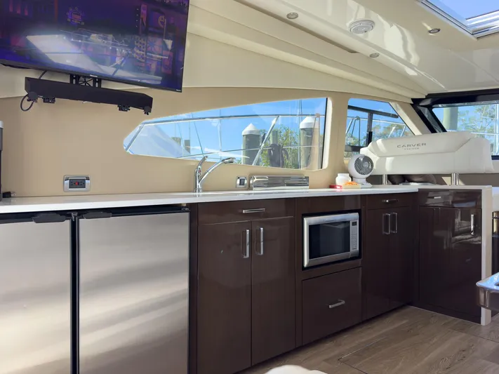 Going Coastal Yacht Photos Pics Interior of a 2019 Carver C43 Coupe yacht with modern kitchen amenities.