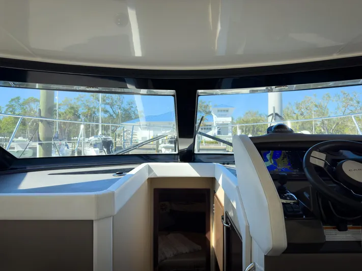 Going Coastal Yacht Photos Pics Interior view of 2019 Carver C43 Coupe yacht cockpit with navigation equipment.