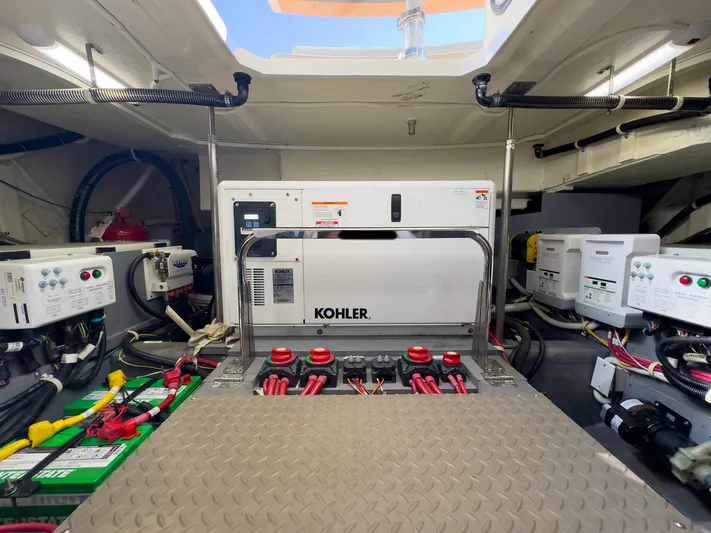 Going Coastal Yacht Photos Pics Engine room of a 2019 Carver C43 Coupe with Kohler generator and electrical systems.