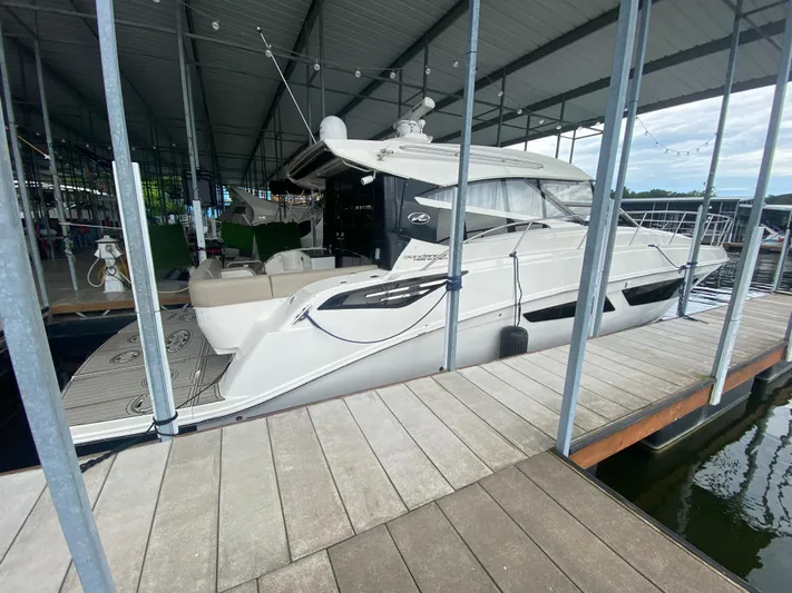  Yacht Photos Pics 2015 Sea Ray 470 Sundancer yacht docked in a covered marina.