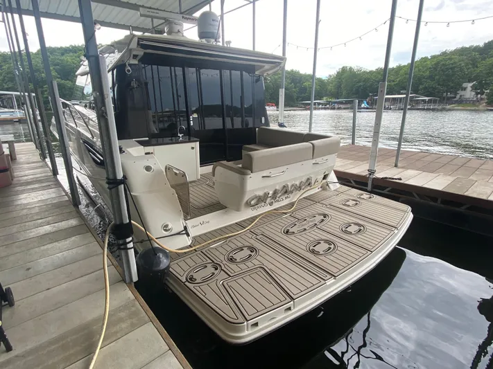  Yacht Photos Pics 2015 Sea Ray 470 Sundancer docked, featuring spacious deck and luxurious seating.