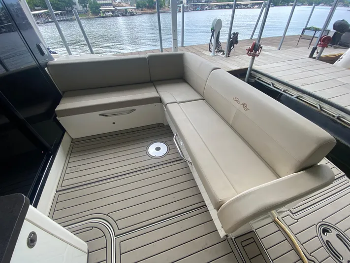  Yacht Photos Pics Luxurious seating area on 2015 Sea Ray 470 Sundancer yacht, docked by the water.