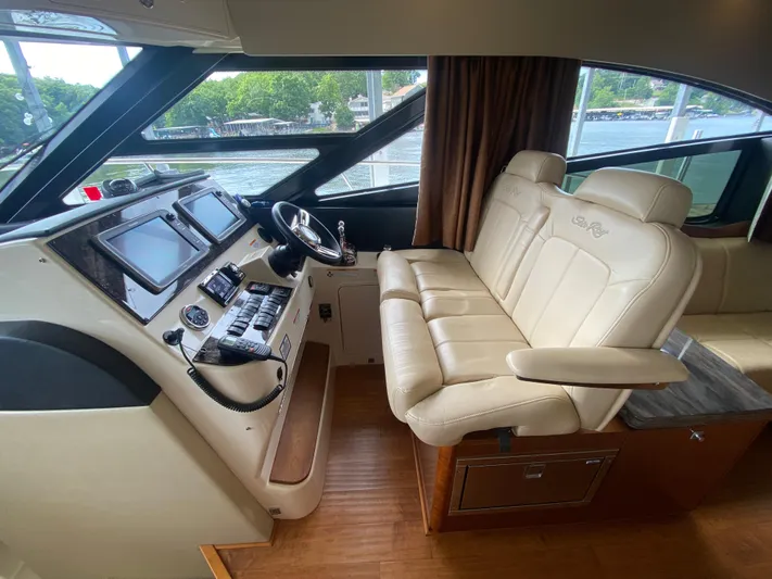  Yacht Photos Pics Helm of 2015 Sea Ray 470 Sundancer with leather seating and modern controls.