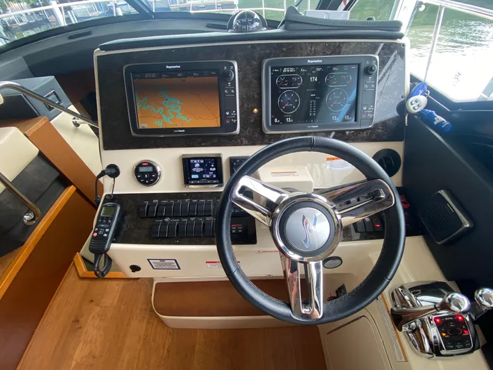  Yacht Photos Pics Helm of 2015 Sea Ray 470 Sundancer with navigation screens and controls.