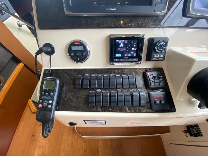  Yacht Photos Pics Control panel of a 2015 Sea Ray 470 Sundancer yacht with various switches and displays.
