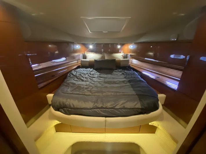  Yacht Photos Pics Luxurious cabin interior of 2015 Sea Ray 470 Sundancer yacht with cozy bedding.
