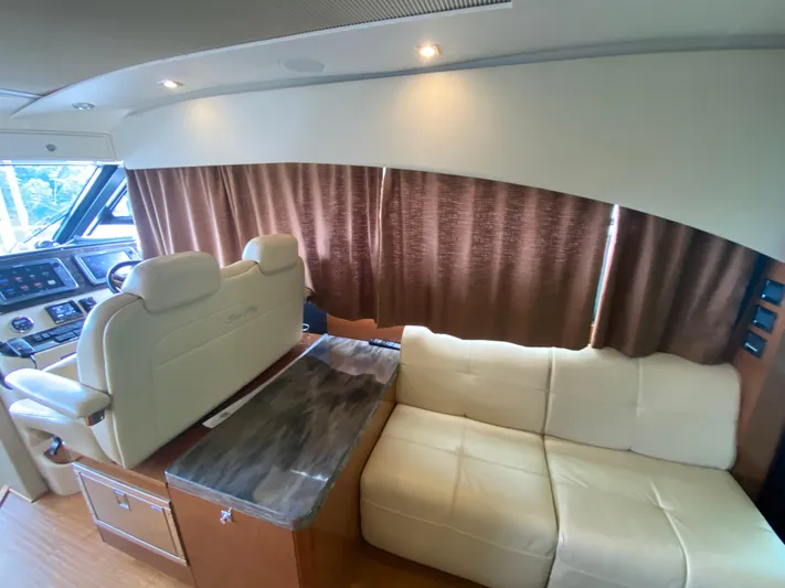  Yacht Photos Pics Interior of 2015 Sea Ray 470 Sundancer yacht with plush seating and modern dashboard.
