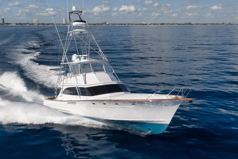 Rose Yacht Photos Pics 1998 Rybovich Convertible yacht cruising on open water under a clear sky.