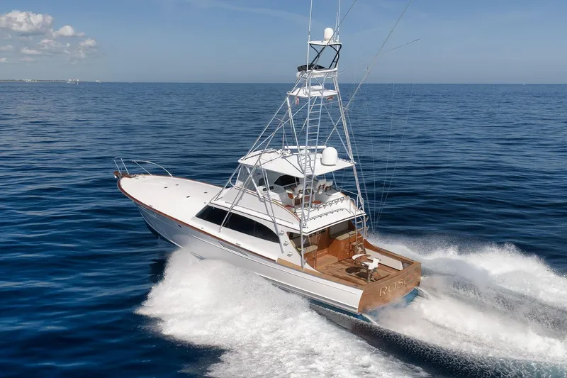 Rose Yacht Photos Pics 1998 Rybovich Convertible yacht cruising on open sea under clear blue sky.