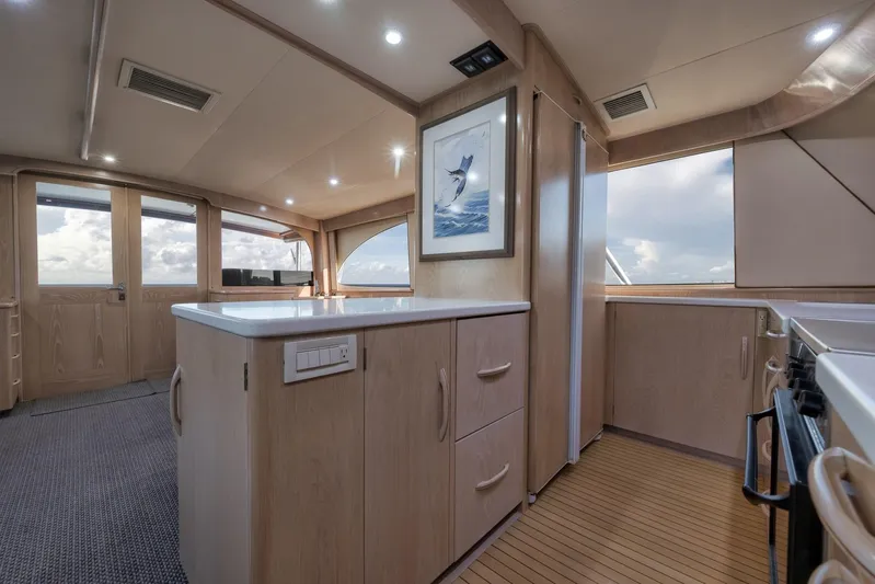 Rose Yacht Photos Pics Luxurious interior of a 1998 Rybovich Convertible yacht with modern kitchen and ocean view.