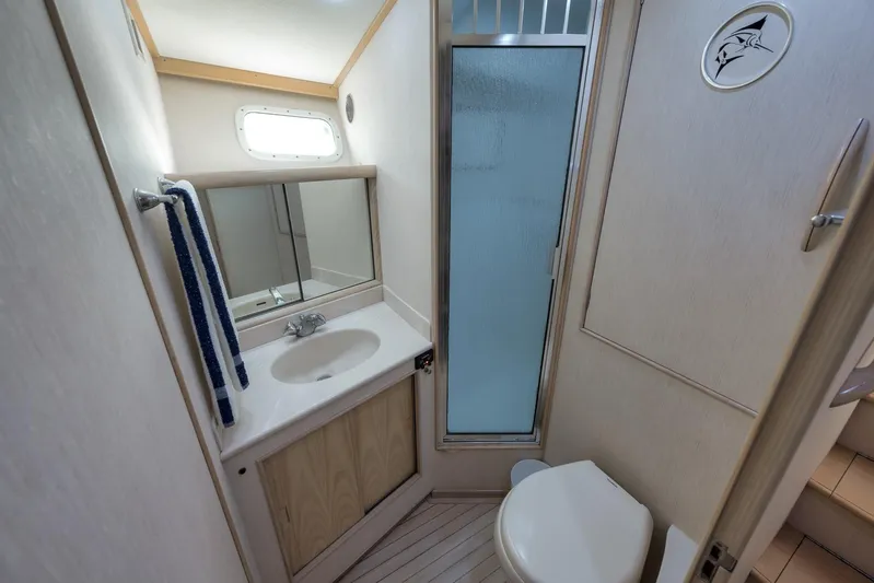 Rose Yacht Photos Pics 1998 Rybovich Convertible yacht bathroom with sink, shower, and toilet.