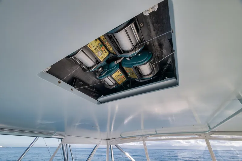 Rose Yacht Photos Pics 1998 Rybovich Convertible boat interior with fishing reel setup, ocean view.