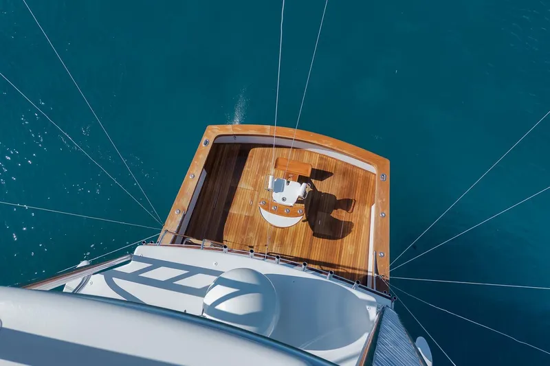 Rose Yacht Photos Pics Overhead view of 1998 Rybovich Convertible yacht deck on blue ocean water.