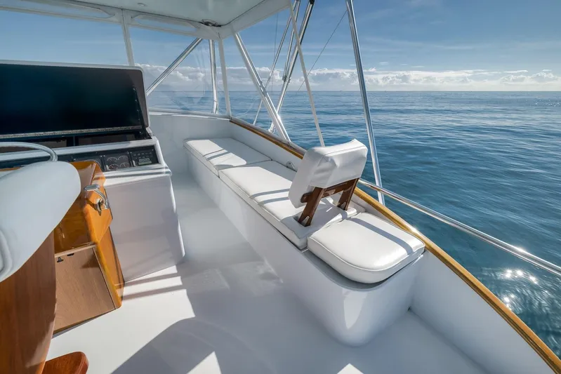 Rose Yacht Photos Pics 1998 Rybovich Convertible yacht interior with ocean view, featuring white seating and helm station.
