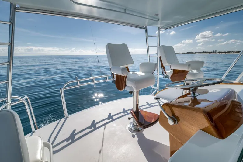 Rose Yacht Photos Pics 1998 Rybovich Convertible yacht deck with ocean view and captain's chairs.