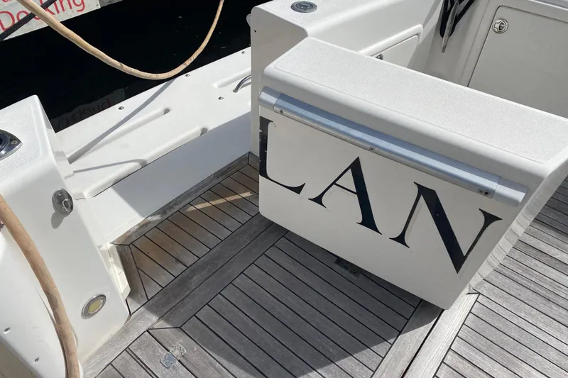 Island Time Yacht Photos Pics Riviera 4000 yacht deck with partial name visible, featuring wooden flooring, 2000 model.