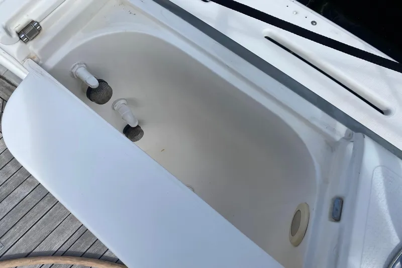 Island Time Yacht Photos Pics Open storage compartment on 2000 Riviera 4000 boat, featuring white interior and fittings.