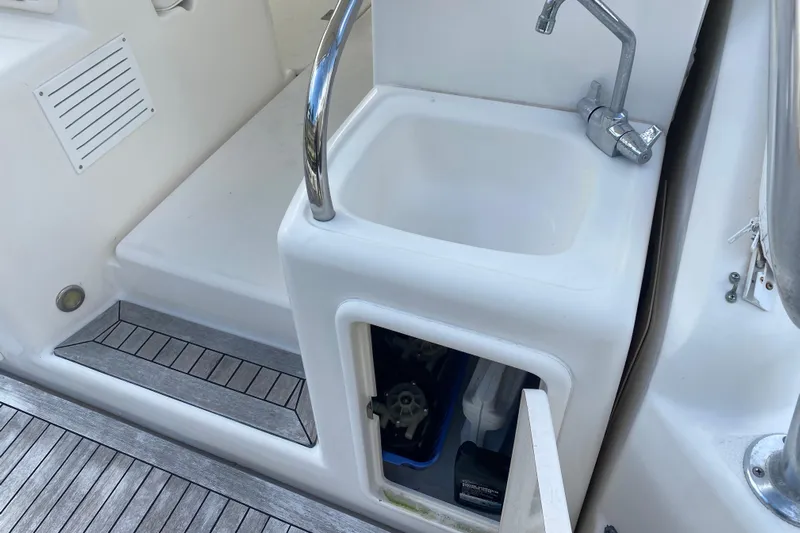 Island Time Yacht Photos Pics Riviera 4000 yacht sink area with storage compartment, 2000 model.