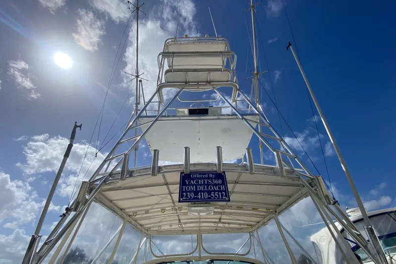 Island Time Yacht Photos Pics Riviera 4000 yacht tower against a bright blue sky, showcasing sleek design and structure.