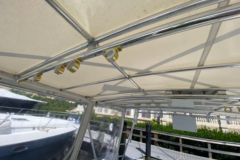 Island Time Yacht Photos Pics Riviera 4000 yacht canopy and framework, 2000 model, docked with clear skies.