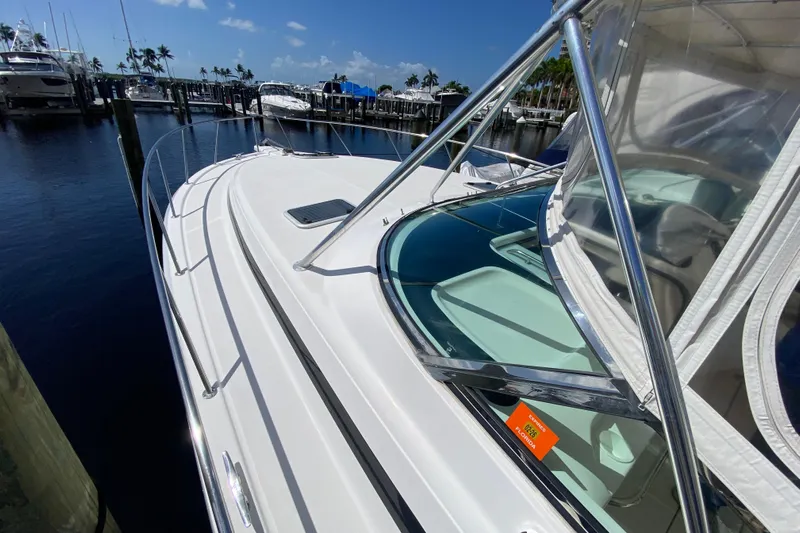 Island Time Yacht Photos Pics 2000 Riviera 4000 yacht docked at marina under clear blue sky.