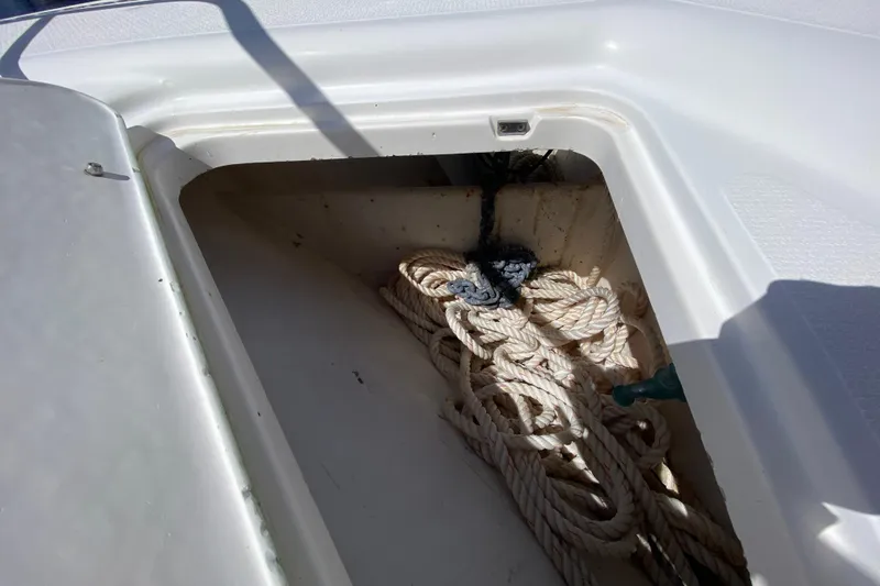 Island Time Yacht Photos Pics Riviera 4000 boat storage compartment with coiled ropes, 2000 model.