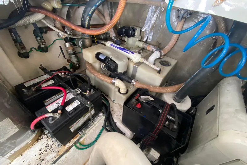 Island Time Yacht Photos Pics Engine compartment of 2000 Riviera 4000 with batteries and plumbing components.