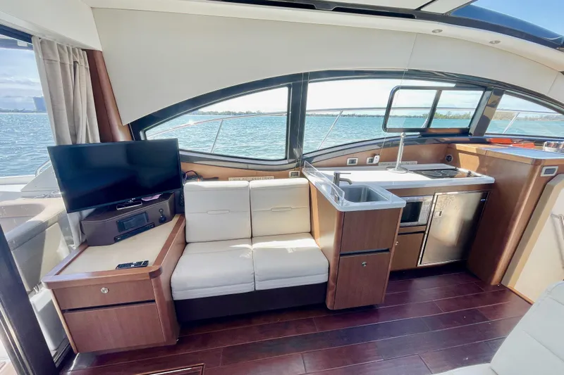  Yacht Photos Pics Interior of 2017 Sea Ray Sundancer 400 yacht with kitchenette and seating area.