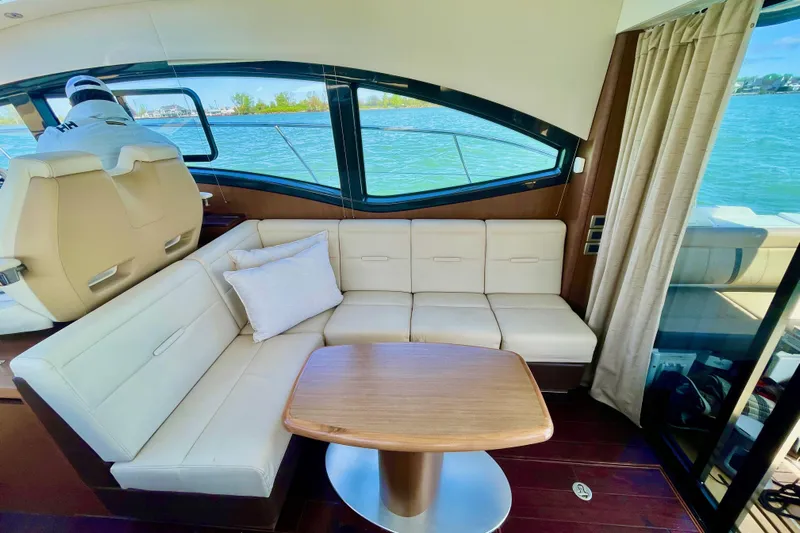  Yacht Photos Pics Interior of 2017 Sea Ray Sundancer 400 yacht with elegant seating and table.