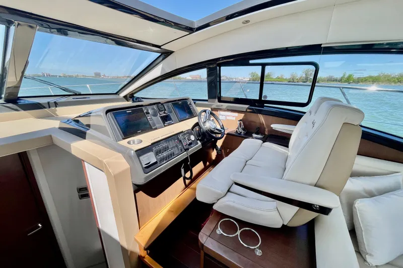  Yacht Photos Pics Luxurious 2017 Sea Ray Sundancer 400 yacht interior with modern helm and panoramic windows.
