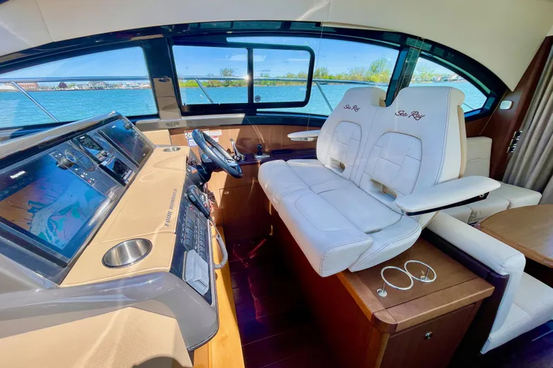  Yacht Photos Pics Interior of 2017 Sea Ray Sundancer 400 yacht with modern helm and seating.