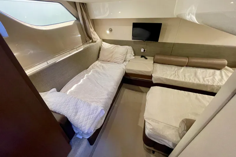  Yacht Photos Pics Luxurious cabin interior of 2017 Sea Ray Sundancer 400 yacht with cozy beds and TV.