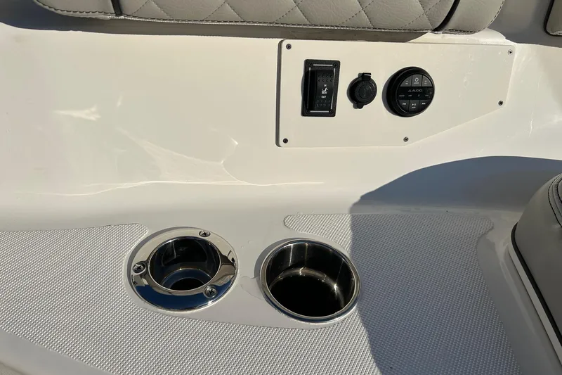  Yacht Photos Pics 2023 Pursuit S 378 Sport boat interior with cup holders and control panel.