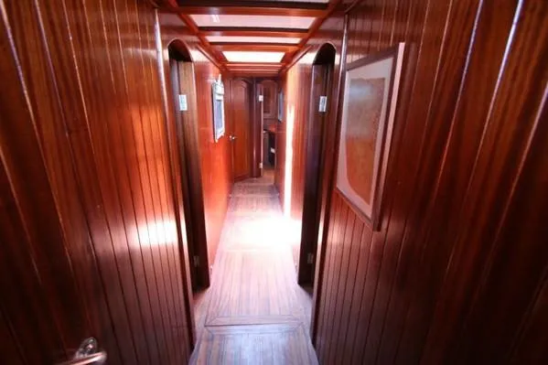 Trİppİn Yacht Photos Pics Wooden interior hallway of 2006 Custom Wooden Ketch Tirhandil 20M yacht.